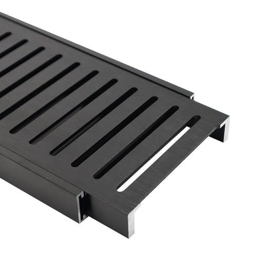 Brushed black aluminium grate drainer for kitchen sink, designed for efficient water drainage and waste cover in modern kitchen and laundry applications.