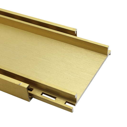 Aluminium tile insert drain in brushed gold finish for bathrooms and wet areas, designed for efficient water drainage with a modern linear floor waste system and concealed tile integration.