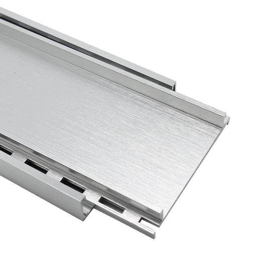Aluminium tile insert drain in brushed silver finish for bathrooms and wet areas, designed for efficient water drainage with a modern linear floor waste system and concealed tile integration.