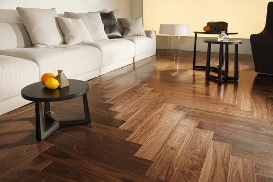 American Walnut herringbone engineered timber flooring by Coswick with a rich natural hardwood finish, durable multi-layer construction, and timeless parquet design for luxury interiors.