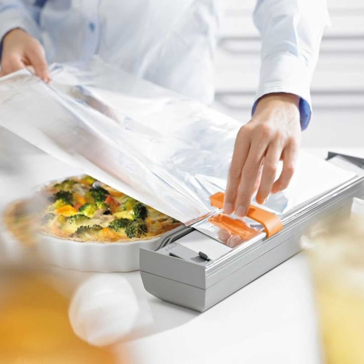 Blum ORGA-LINE drawer insert aluminium foil cutter ZSZ-02F1 in dust grey/orange for practical kitchen drawer organisation