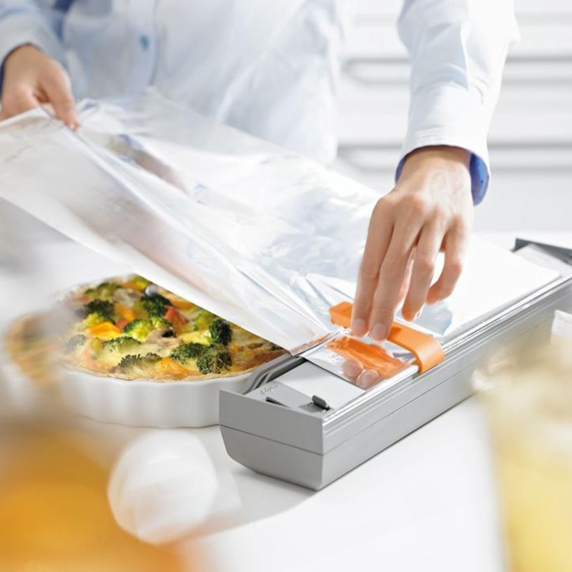 Blum ORGA-LINE drawer insert aluminium foil cutter ZSZ-02F1 in dust grey/orange for practical kitchen drawer organisation