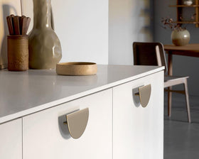 Furnipart Horizon Handle. Finish: Brushed Brass. Material: Zamac. Length: 140mm. Height: 70mm. Protrusion: 28mm. Hole Centres: 64mm by W&B