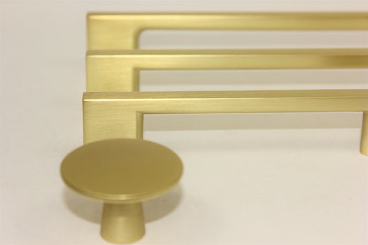 Brushed gold Craftline round cabinet knob for contemporary kitchen cabinets, drawers, and furniture