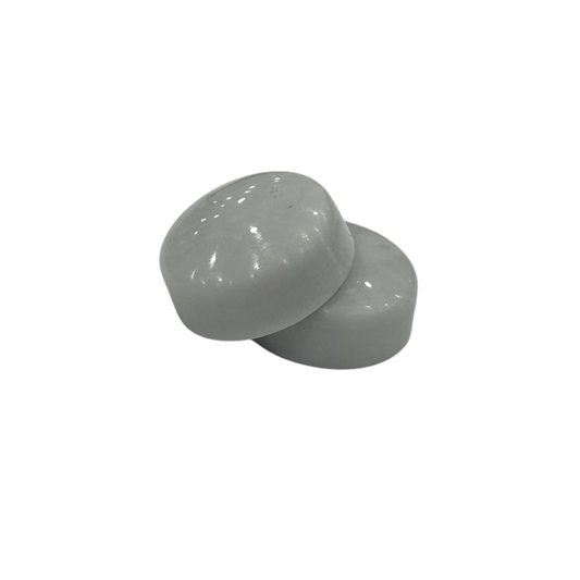 Grey snap-on screw caps for covering exposed screws on cabinets and furniture