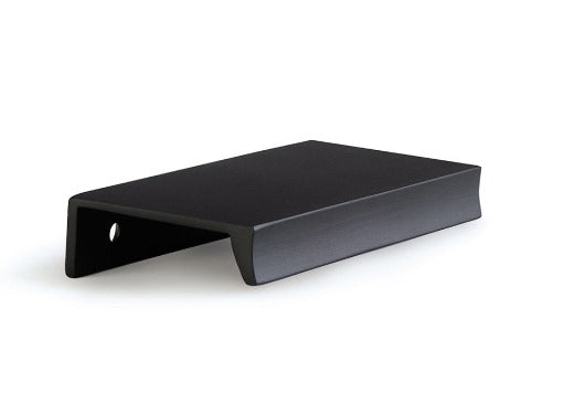 Matte black edge pull handle installed on modern kitchen cabinet door for a sleek minimalist finish