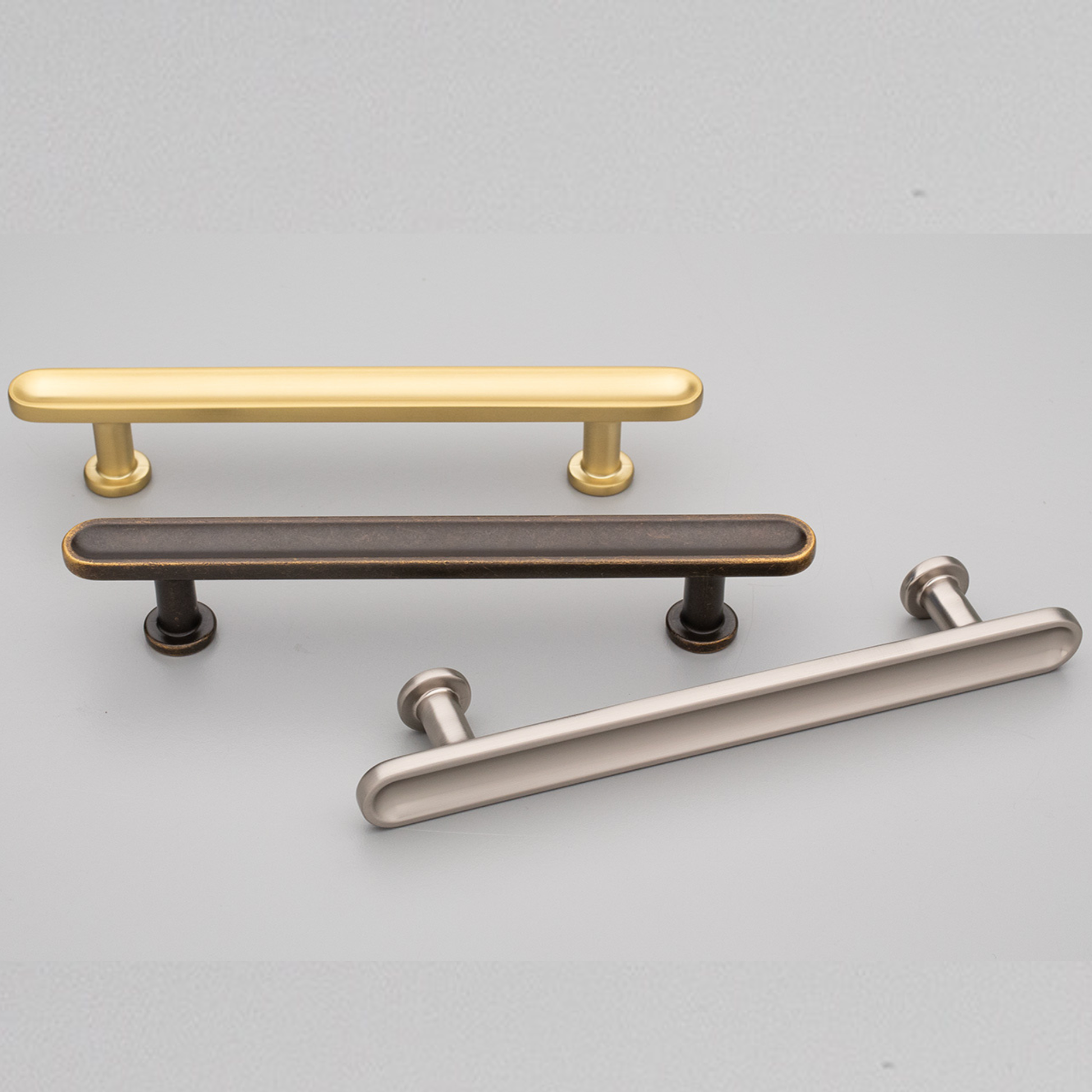 Kethy Randers die-cast zinc cabinet pull handle in Antique Brown, Dark Brushed Gold, and Stainless Effect finishes