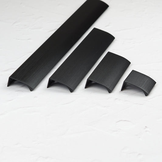 Modern matte black aluminium edge cabinet handle used on kitchen cupboard door for sleek minimalist finish
