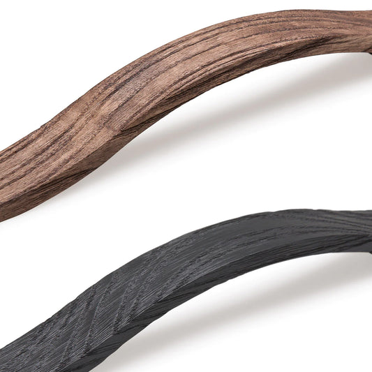 Momo Calin cabinet handle on modern cabinetry, sculptural minimalist pull design for kitchen and furniture, contemporary architectural hardware in premium finish