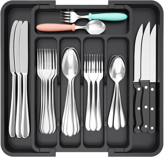 Black expandable cutlery drawer organiser with 7 compartments for neatly storing knives, forks, spoons, and kitchen utensils.