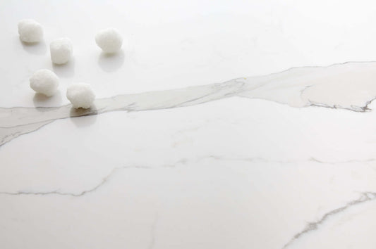 Elegant Calacutta Roma quartz stone with marble-inspired veining for stylish kitchen and bathroom renovations.