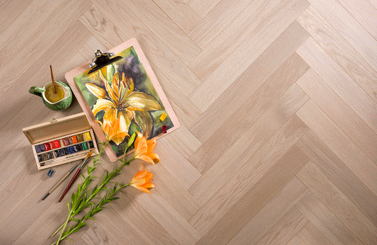 Coswick Titanium Buff herringbone engineered oak timber flooring featuring a warm neutral buff finish, durable European oak construction, and timeless parquet design for stylish residential and commercial interiors.