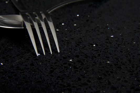 Galaxy Black standard quartz stone featuring a sleek black finish with subtle speckled detail for modern kitchen and bathroom benchtops.