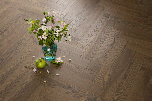 French Riviera timber herringbone flooring with classic parquet design and realistic oak wood appearance