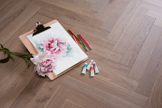 European oak herringbone engineered flooring in Spinel Grey by Coswick, combining natural wood beauty, strength, and a stylish parquet layout.
