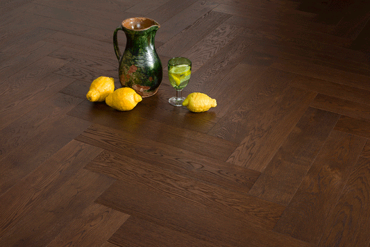 Coswick Milk Chocolate herringbone engineered oak timber flooring with a warm brown finish, durable European oak construction, and a timeless parquet design for residential and commercial interiors.