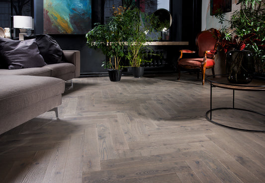 Norman Breeze herringbone engineered timber flooring by Coswick featuring a natural oak finish, durable multi-layer construction, and timeless parquet design for residential and commercial interiors.