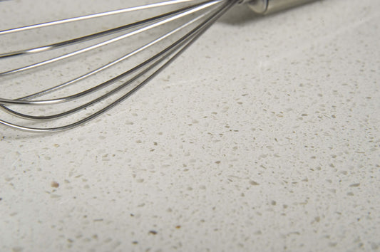 Polar White quartz stone with a bright white engineered surface for kitchen benchtops, bathroom vanities, and laundry countertops.