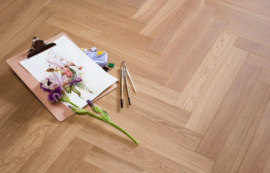 Raw Sienna herringbone engineered timber flooring in European oak with a warm natural wood finish, durable construction, and timeless parquet design for modern Australian homes.